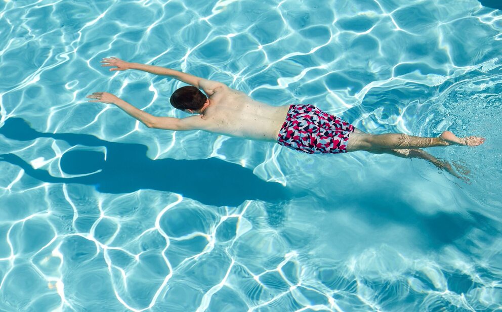 person swimming in pool