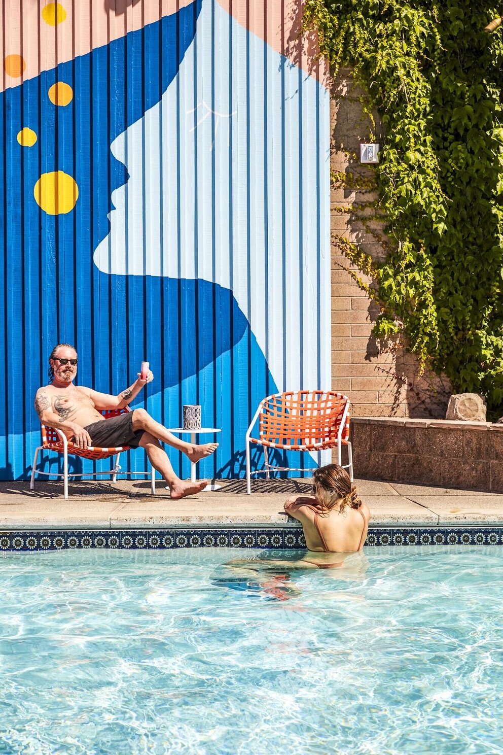 people lounging at pool