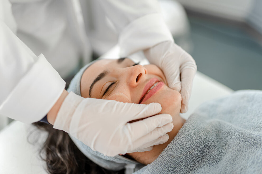 woman receiving facial